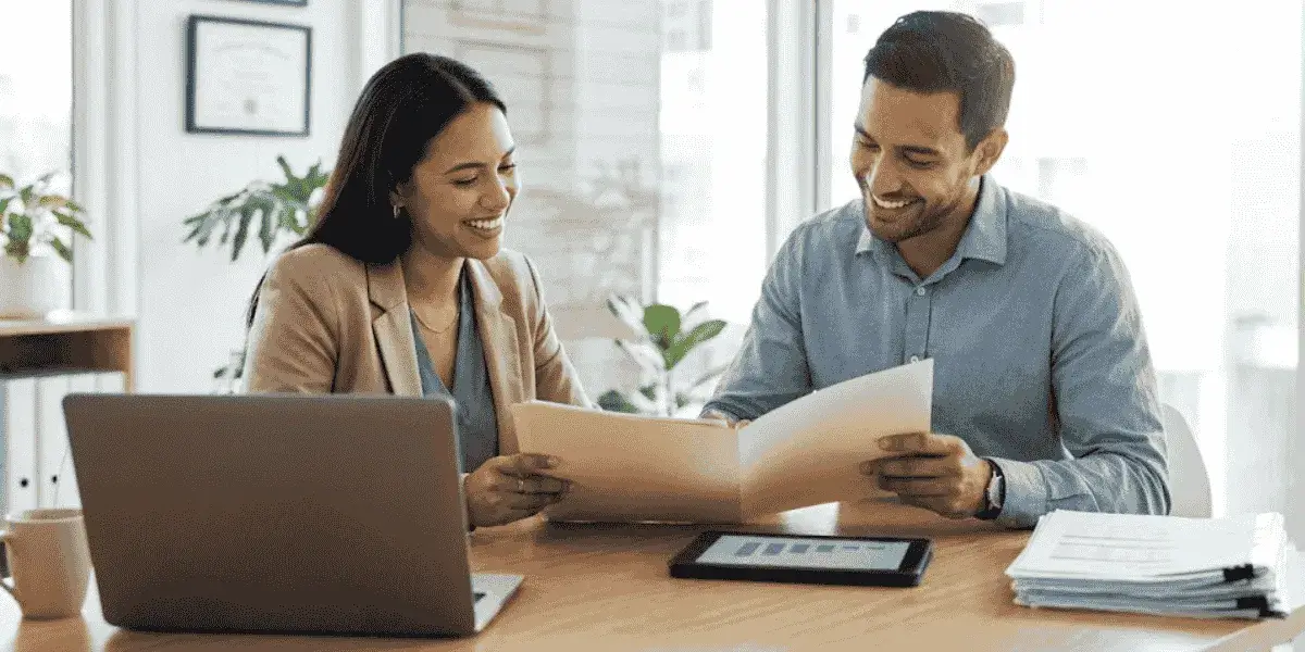 business owner and advisor reviewing financial documents for small business loans approval